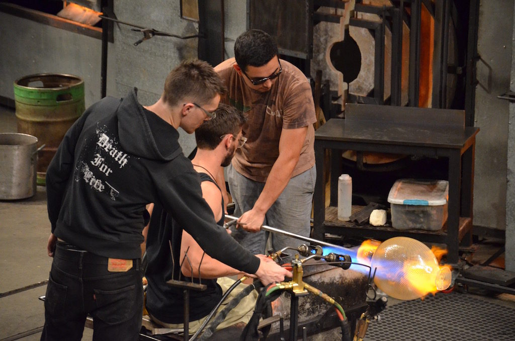 Artists working on a piece in the Cone workshop