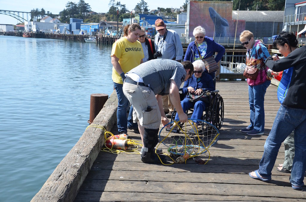 Fishermen on the pier catching crabs.