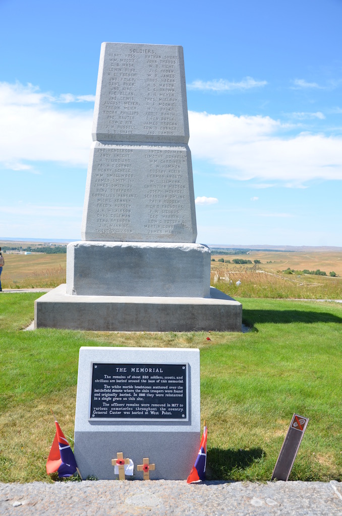 This enclosed cemetery was the men in Custer's command. The black stone is Custer.